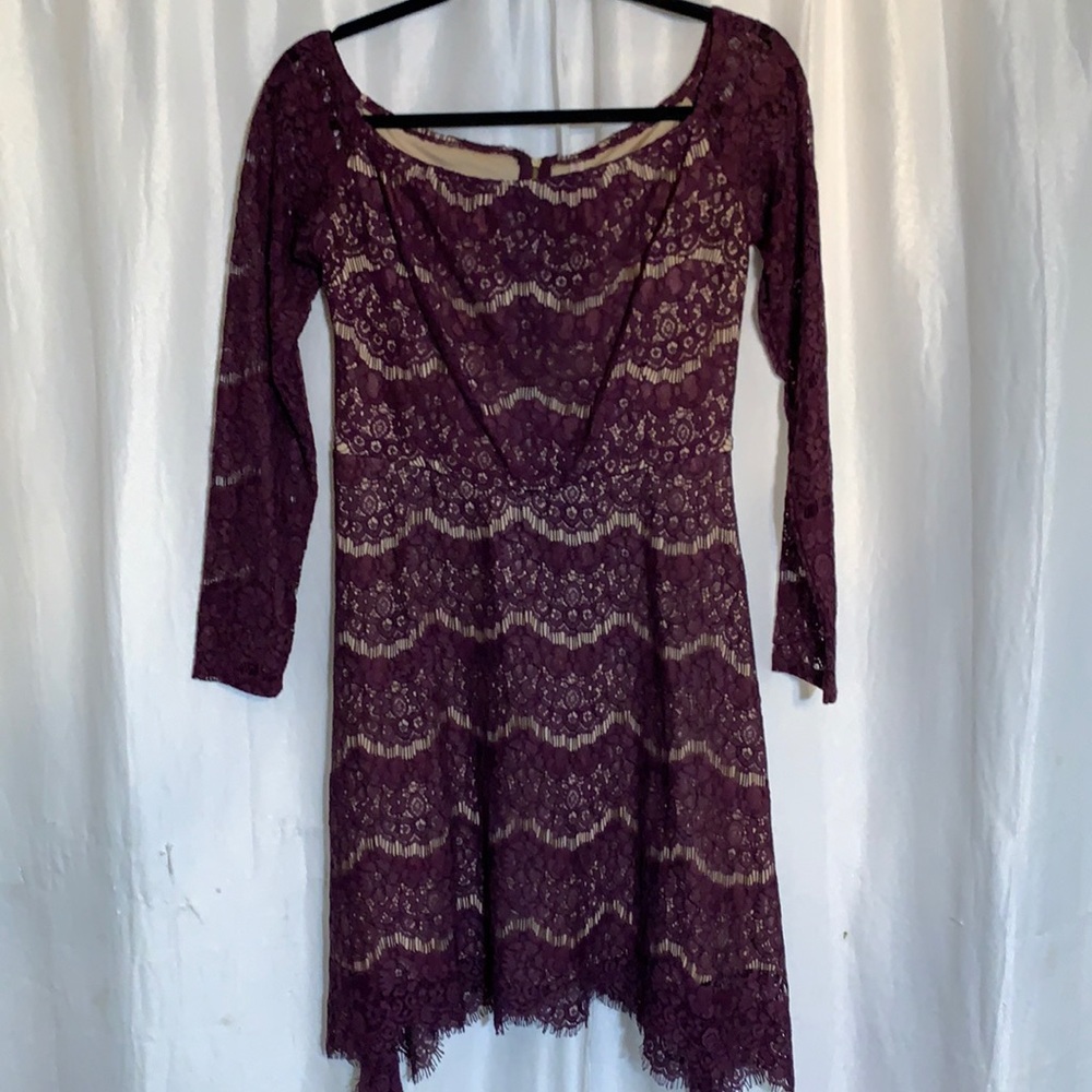 Deep purple color dress, from inside is tan color.
